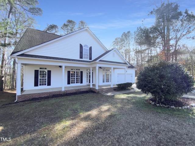 view of front of home with covered porch and a front yard