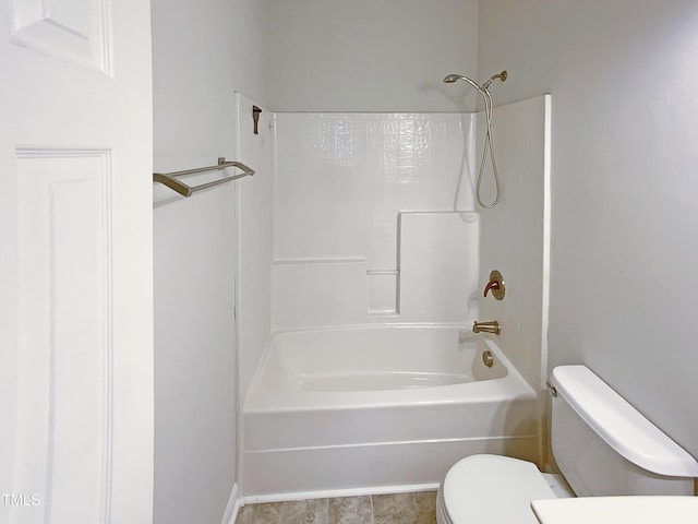 bathroom featuring shower / bath combination and toilet