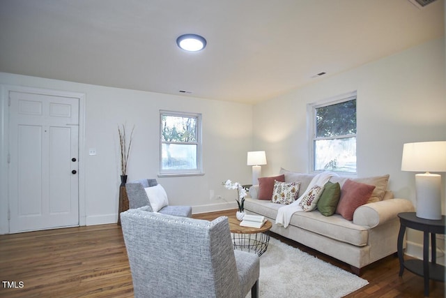 living room featuring dark hardwood / wood-style flooring