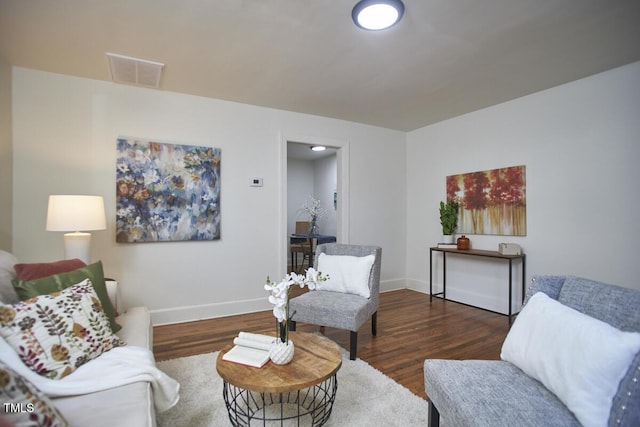 living room featuring dark wood-type flooring