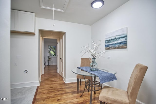 dining area with light hardwood / wood-style floors