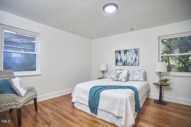 bedroom featuring dark wood-type flooring