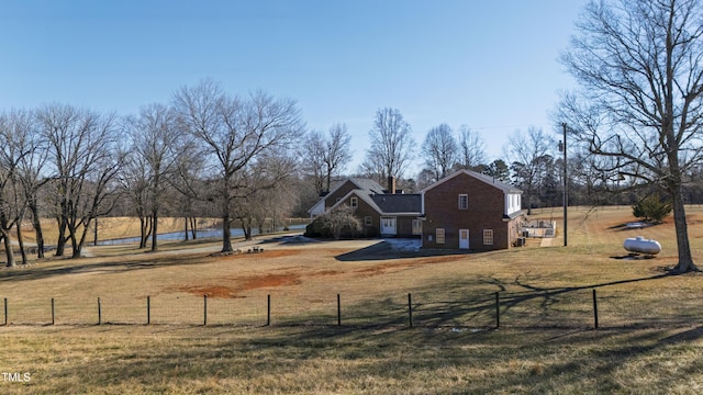 view of yard with a rural view