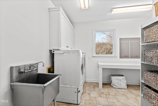 washroom featuring cabinets, washer hookup, and sink