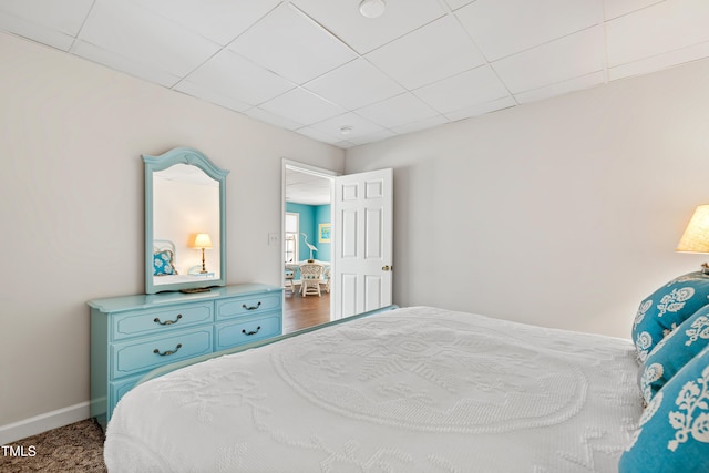bedroom with a paneled ceiling