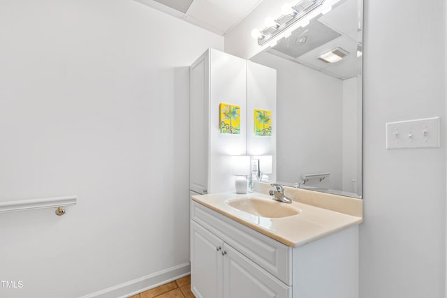 bathroom featuring tile patterned floors, toilet, and vanity