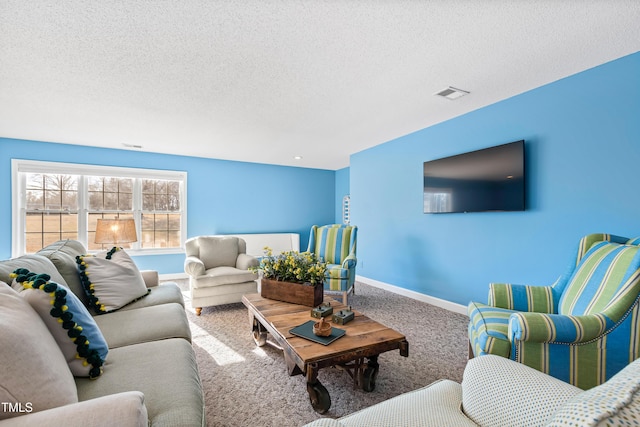 living room with carpet floors and a textured ceiling