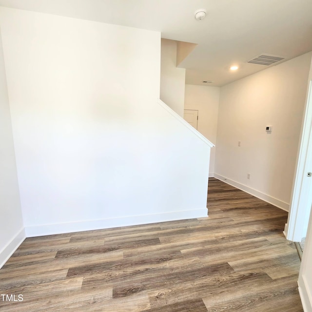 unfurnished room with dark hardwood / wood-style floors