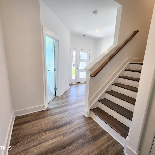 staircase featuring hardwood / wood-style flooring