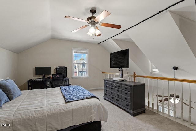 carpeted bedroom with ceiling fan and lofted ceiling