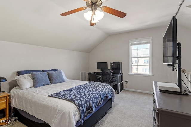 carpeted bedroom featuring ceiling fan and vaulted ceiling