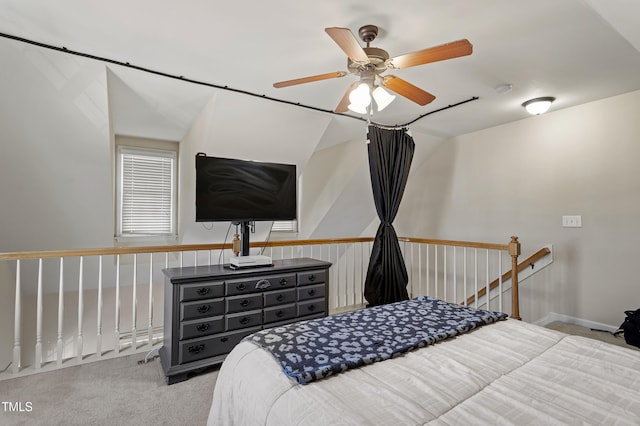 bedroom with vaulted ceiling, ceiling fan, and light colored carpet