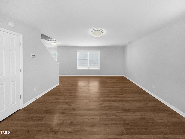 empty room featuring dark wood-type flooring