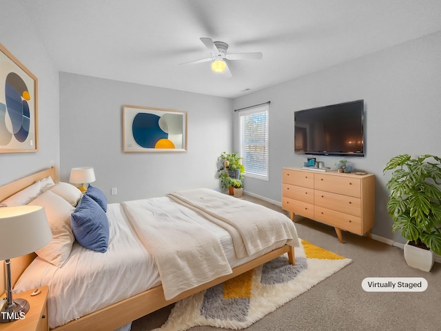 bedroom with ceiling fan and carpet