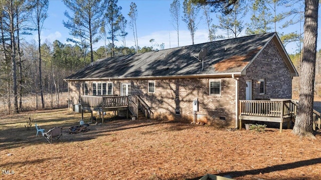 rear view of property with a deck