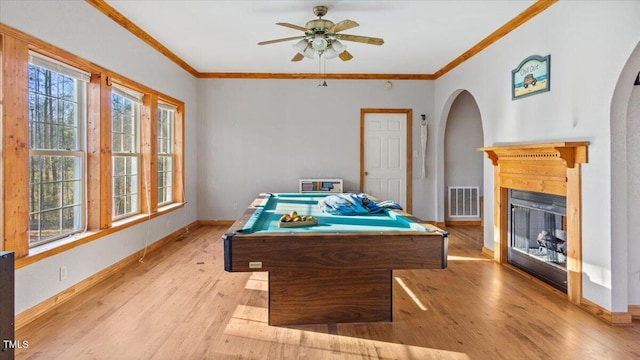 playroom featuring ceiling fan, pool table, crown molding, and light wood-type flooring