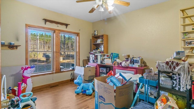 interior space featuring ceiling fan and hardwood / wood-style floors