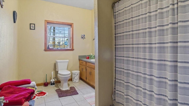 bathroom with toilet, a shower with shower curtain, tile patterned flooring, and vanity