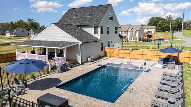 view of swimming pool featuring an outdoor hangout area and a patio area