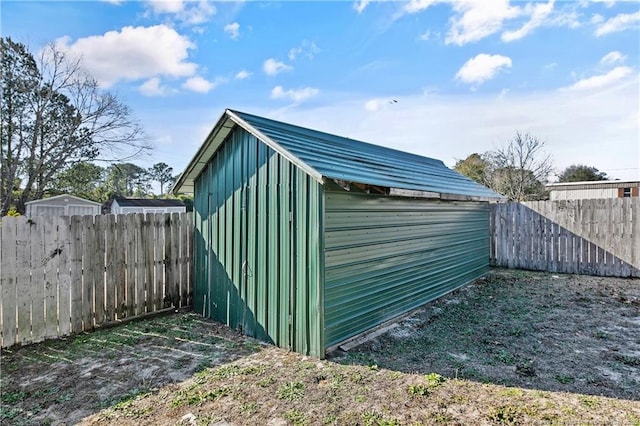 view of shed featuring a fenced backyard