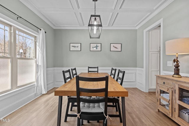 dining space featuring coffered ceiling and light wood-type flooring