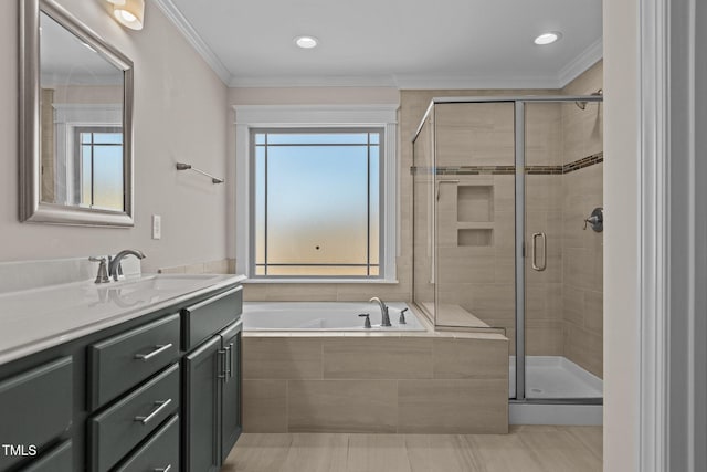 bathroom with tile patterned floors, ornamental molding, separate shower and tub, and vanity