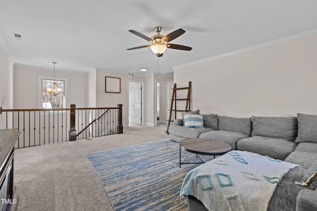 carpeted living room featuring ornamental molding and ceiling fan with notable chandelier