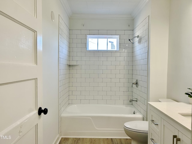 full bathroom featuring ornamental molding, tiled shower / bath combo, wood-type flooring, and vanity