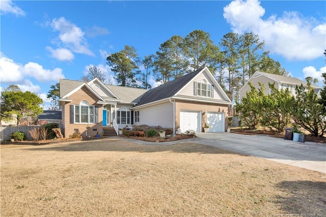 view of front of home with a front yard and a garage