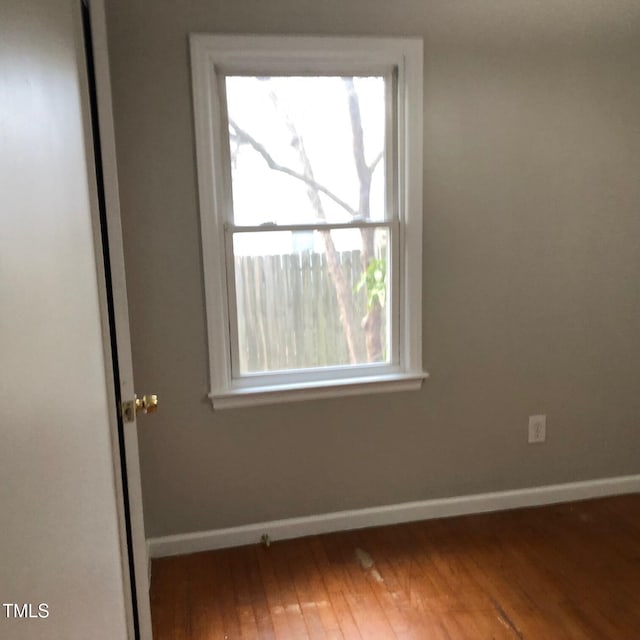 spare room featuring hardwood / wood-style floors