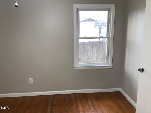 empty room featuring dark hardwood / wood-style floors