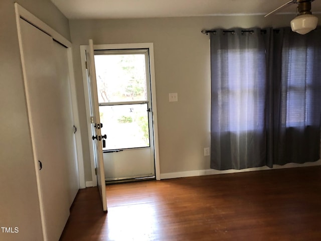 doorway to outside featuring a healthy amount of sunlight and hardwood / wood-style floors