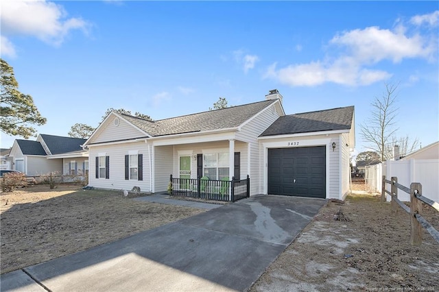 ranch-style house featuring a garage and a porch