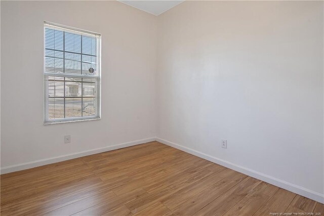 unfurnished room featuring light hardwood / wood-style floors