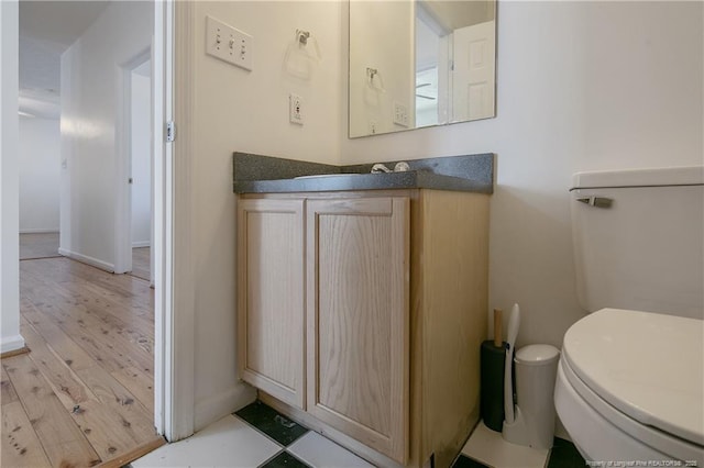 bathroom with toilet and vanity