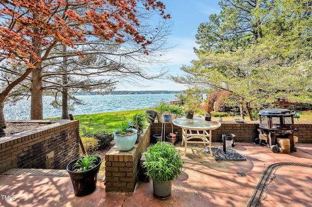 view of patio featuring a water view