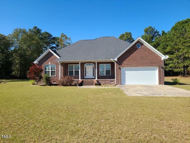 view of front of property with a front yard and a garage