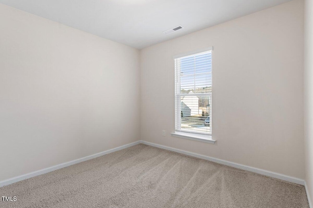 view of carpeted spare room