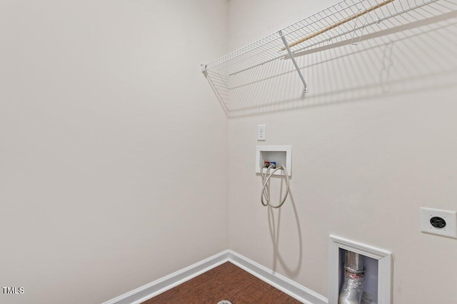 washroom with hookup for a washing machine and hookup for an electric dryer