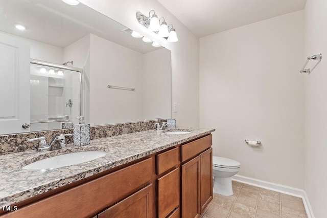 bathroom with toilet, walk in shower, and vanity