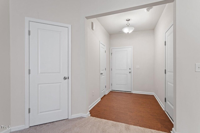 doorway featuring light carpet