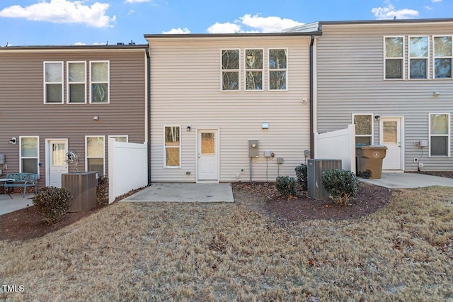 back of property featuring central air condition unit and a patio area