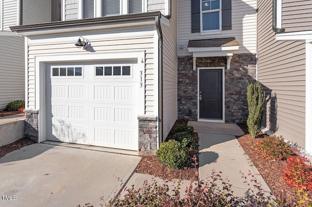 doorway to property featuring a garage