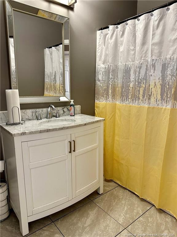 bathroom featuring tile patterned floors and vanity