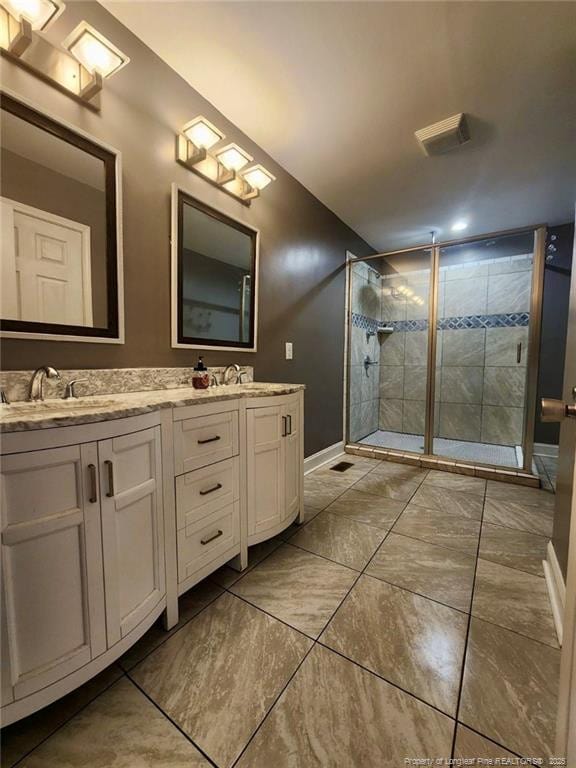 bathroom with an enclosed shower and vanity