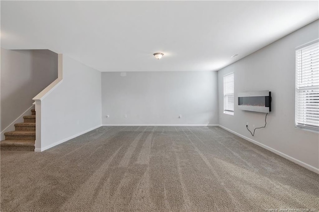 unfurnished living room featuring carpet floors