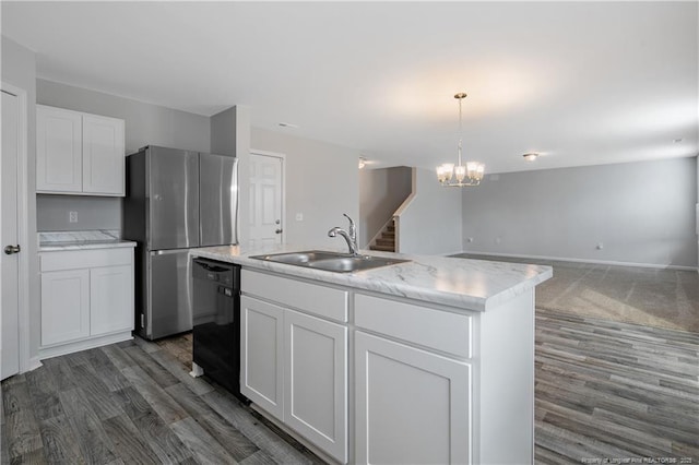 kitchen with white cabinetry, a center island with sink, stainless steel fridge, decorative light fixtures, and dishwasher