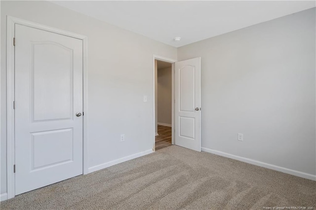 unfurnished bedroom featuring carpet flooring