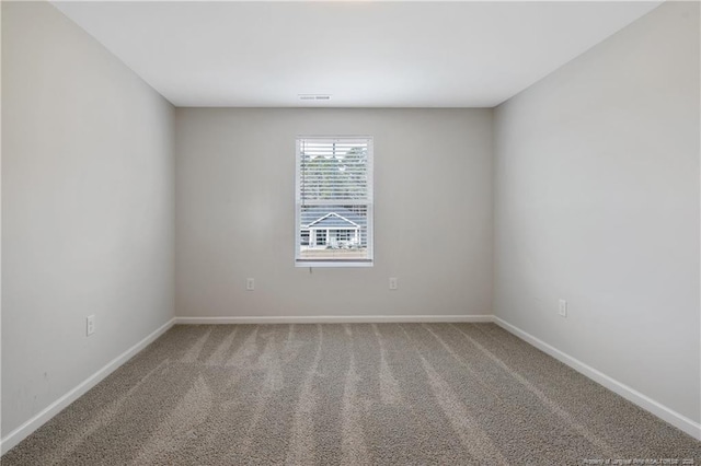 unfurnished room featuring carpet flooring