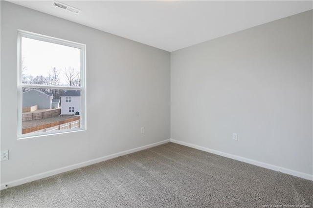 empty room featuring carpet flooring